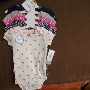 4 bodysuits newborn size with tags